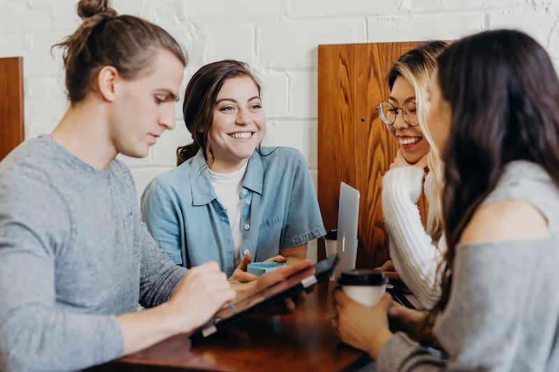 Employees at a small team meeting